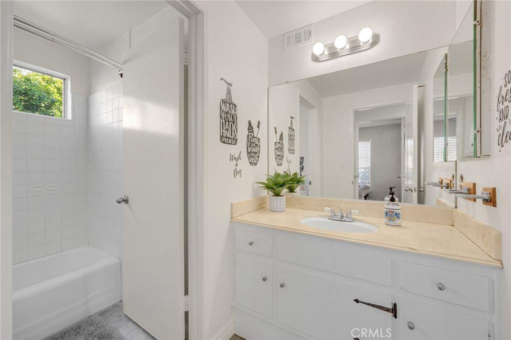 358 Lotus Place Brea, CA 92821 - Photo 21 of 31 a bathroom with a bathtub a sink and a mirror