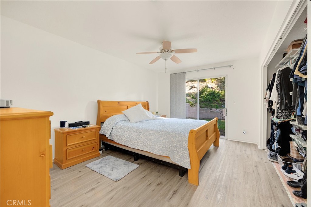 358 Lotus Place Brea, CA 92821 - Photo 23 of 31 a bedroom with a bed and wooden floor
