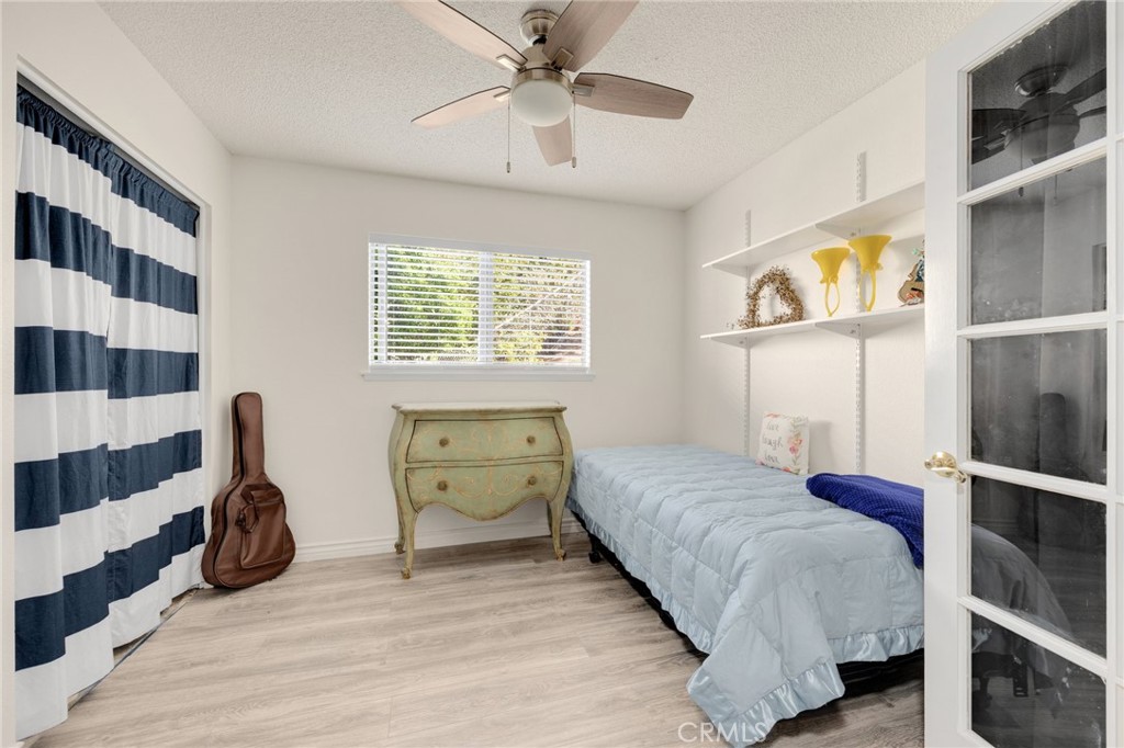 358 Lotus Place Brea, CA 92821 - Photo 24 of 31 a bedroom with a bed and a window