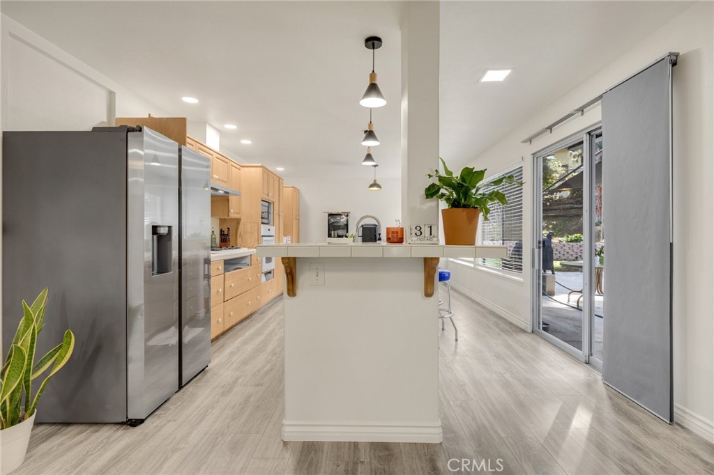 358 Lotus Place Brea, CA 92821 - Photo 10 of 31 a kitchen with stainless steel appliances a refrigerator a sink a stove top oven a counter space and cabinets