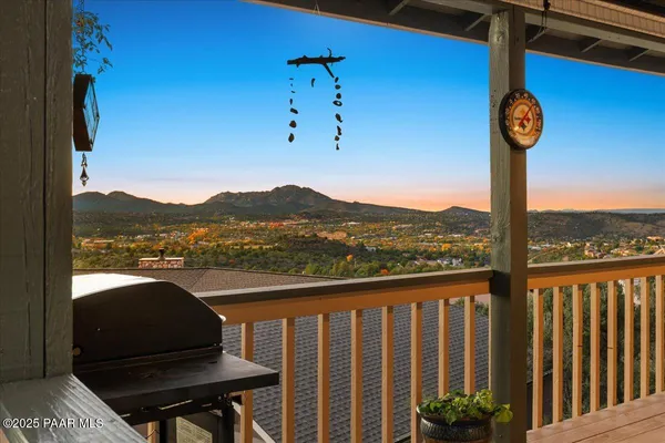 a view of a dining room with furniture wooden floor and chandelier