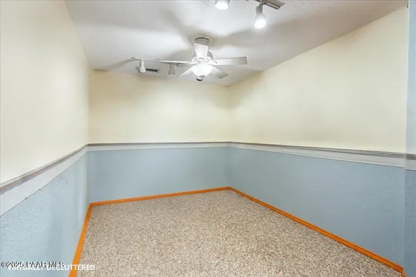 a white bath tub sitting in a bathroom next to a window