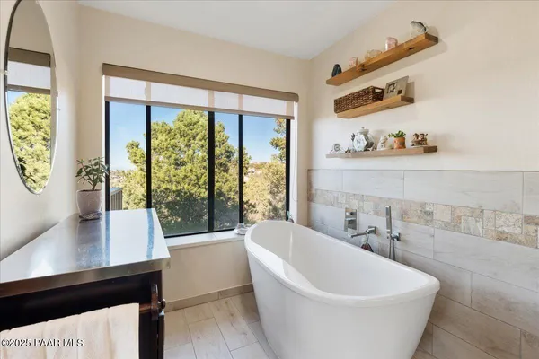 a view of a yard with wooden fence