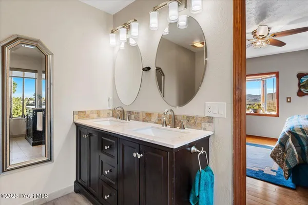 a view of backyard with a deck and furniture