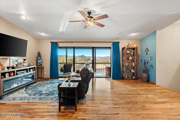 a room with pool table and windows