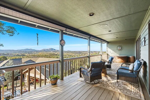 a view of city and mountain from a balcony
