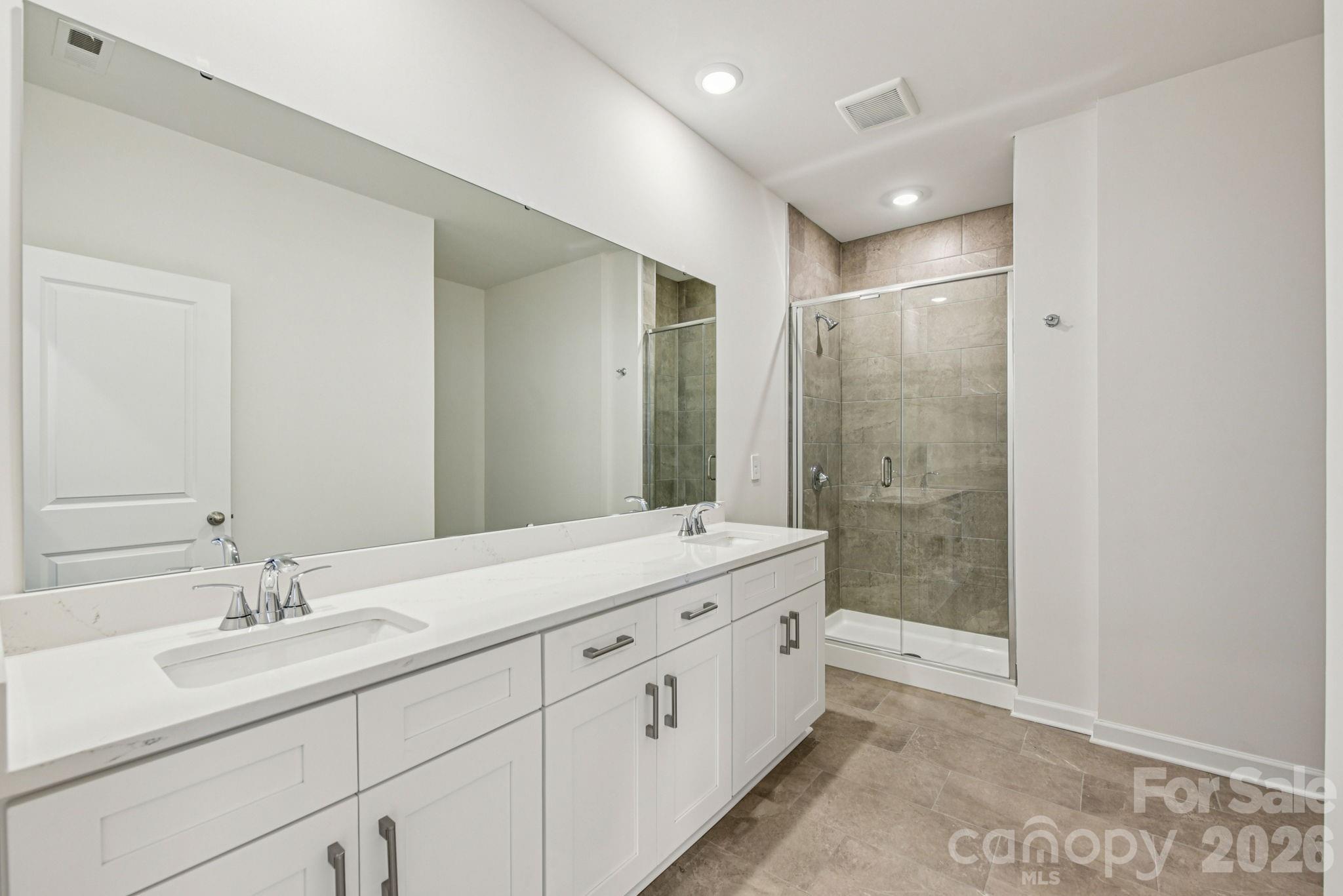 708 Palmer Pendleton Way York, SC 29745 - Photo 15 of 26 a bathroom with a double vanity sink mirror double and shower