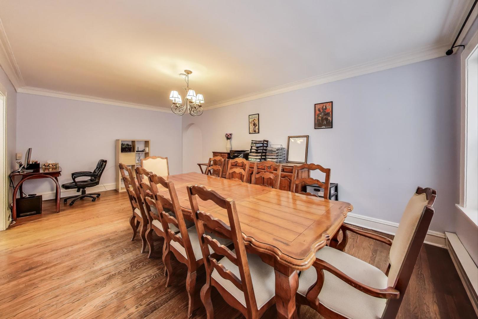 2322 West Farwell Avenue, Unit 1W Chicago, IL 60645 - Photo 15 of 28 a view of a dining room with furniture and wooden floor