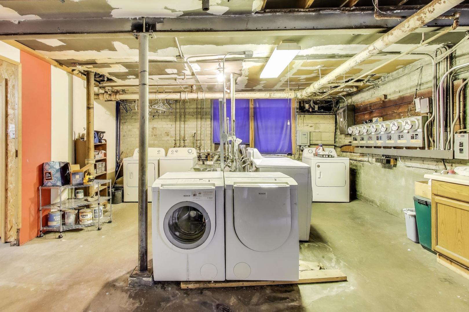 2322 West Farwell Avenue, Unit 1W Chicago, IL 60645 - Photo 24 of 28 a utility room with dryer washer and a view of living room