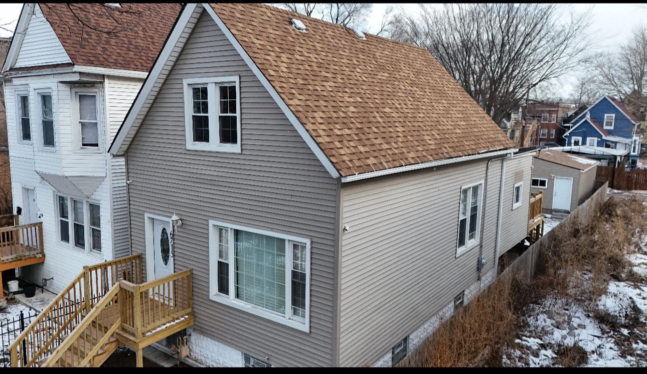 6715 South Sangamon Street Chicago, IL 60621 - Photo 2 of 43 a view of a house with a wooden deck