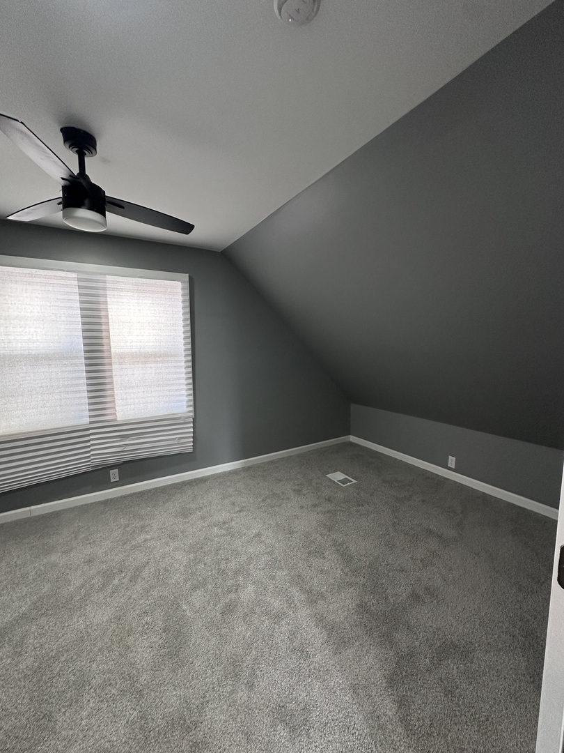 6715 South Sangamon Street Chicago, IL 60621 - Photo 22 of 43 a view of an empty room with a window