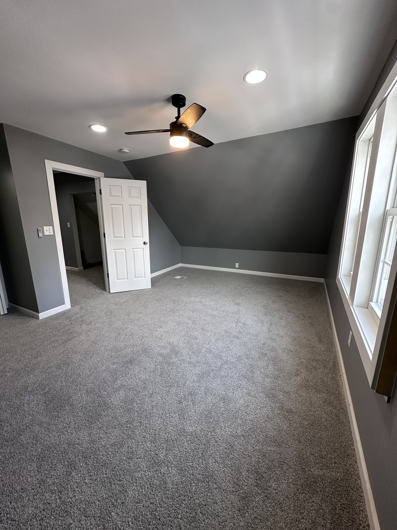 6715 South Sangamon Street Chicago, IL 60621 - Photo 24 of 43 en empty room with windows and stairs