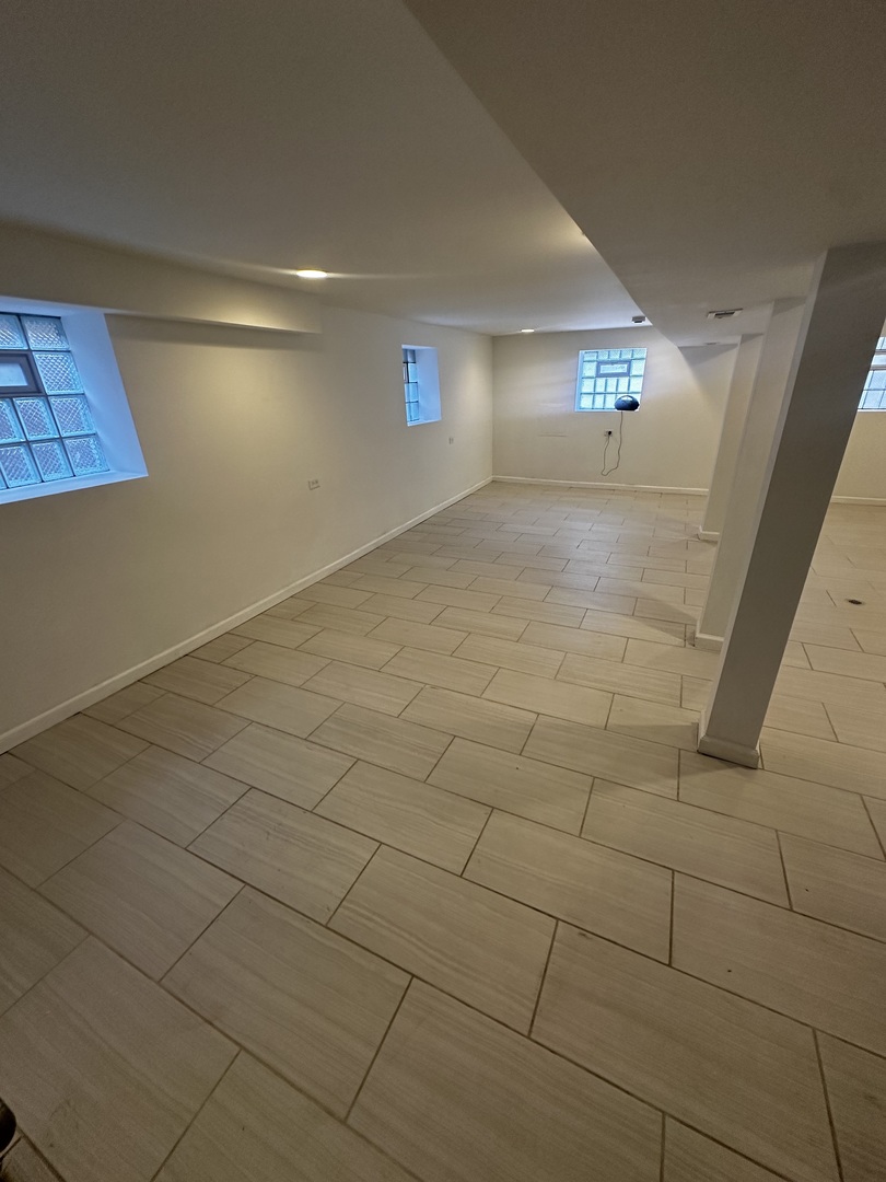 6715 South Sangamon Street Chicago, IL 60621 - Photo 27 of 43 a view of an empty room and window