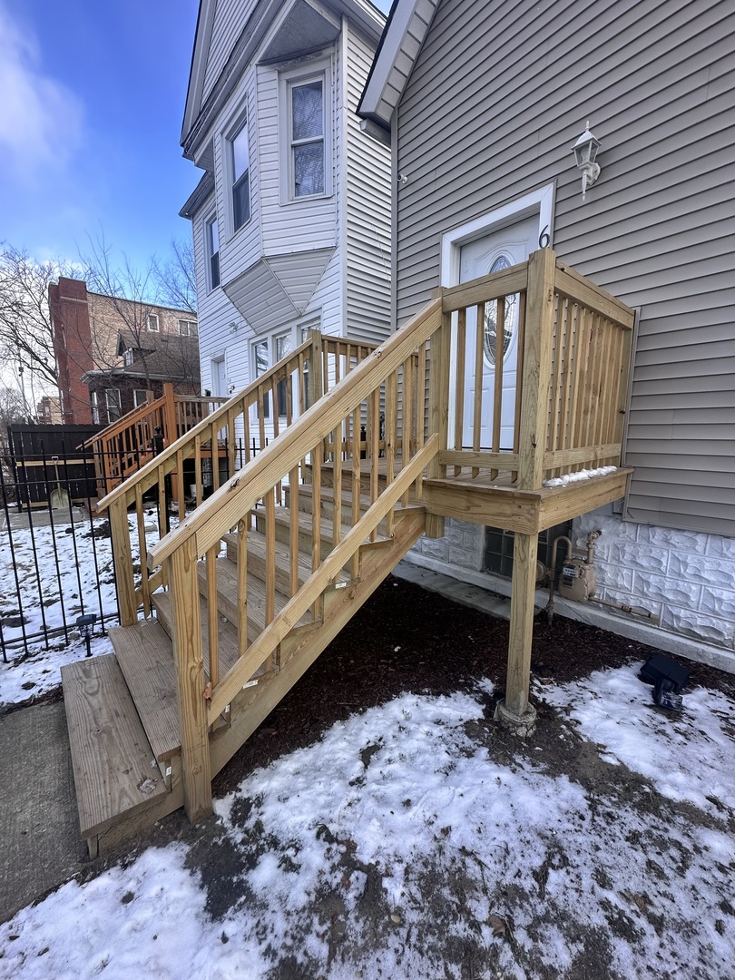 6715 South Sangamon Street Chicago, IL 60621 - Photo 3 of 43 a view of a house with wooden deck