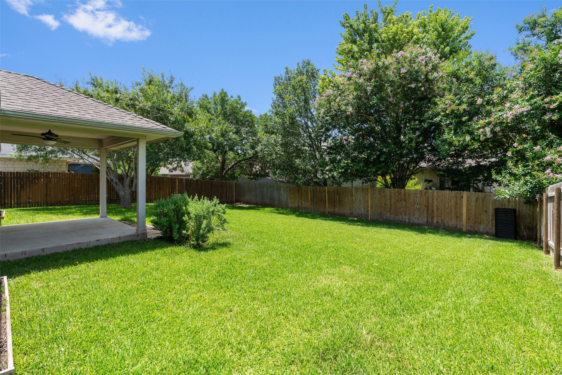 122 Copperwood Loop Round Rock, TX 78665 - Photo 22 of 40 The mature greenery and wood fencing creates a private setting.