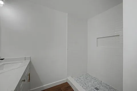 a bathroom with a sink and vanity