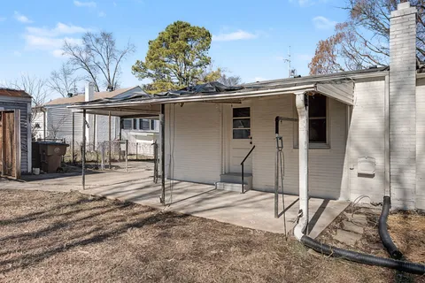 a house with trees in the background