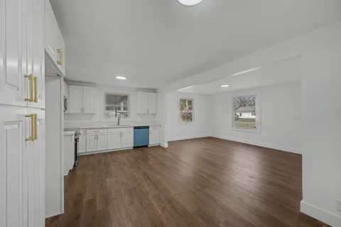 a view of kitchen with wooden floor