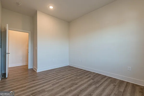 a view of room with wooden floor