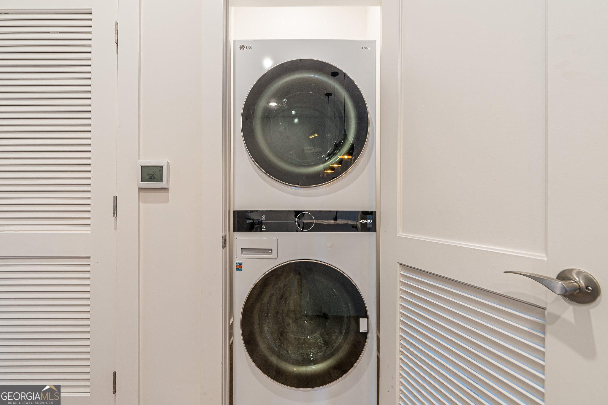 112 Rogers Street Northeast, Unit 601 Atlanta, GA 30317 - Photo 19 of 31 a utility room with dryer and washer