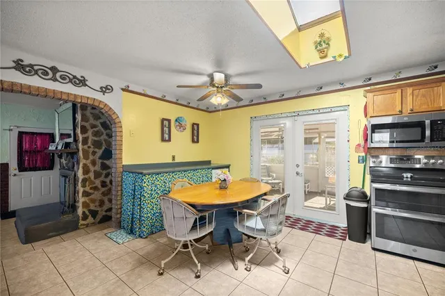 a view of a dining room with furniture window and outside view