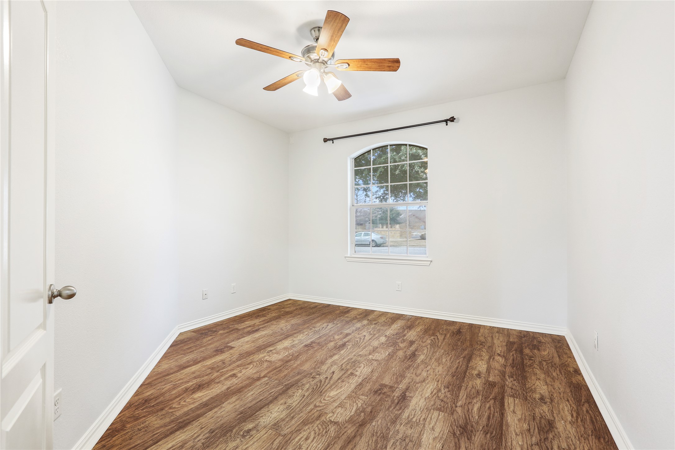 3900 Brean Down Road Pflugerville, TX 78660 - Photo 14 of 35 an empty room with a window and a ceiling fan