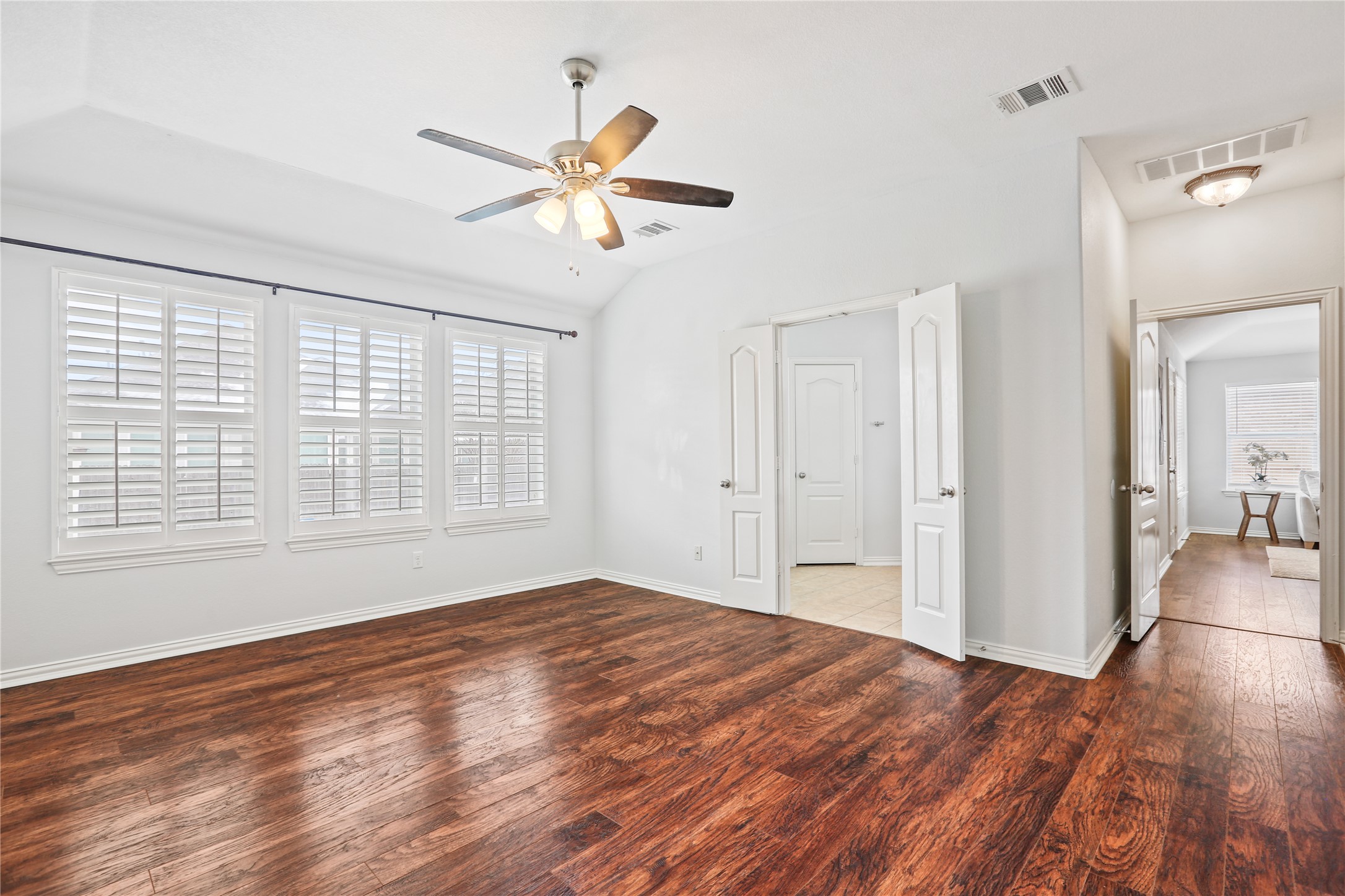 3900 Brean Down Road Pflugerville, TX 78660 - Photo 21 of 35 a view of empty room with wooden floor and fan