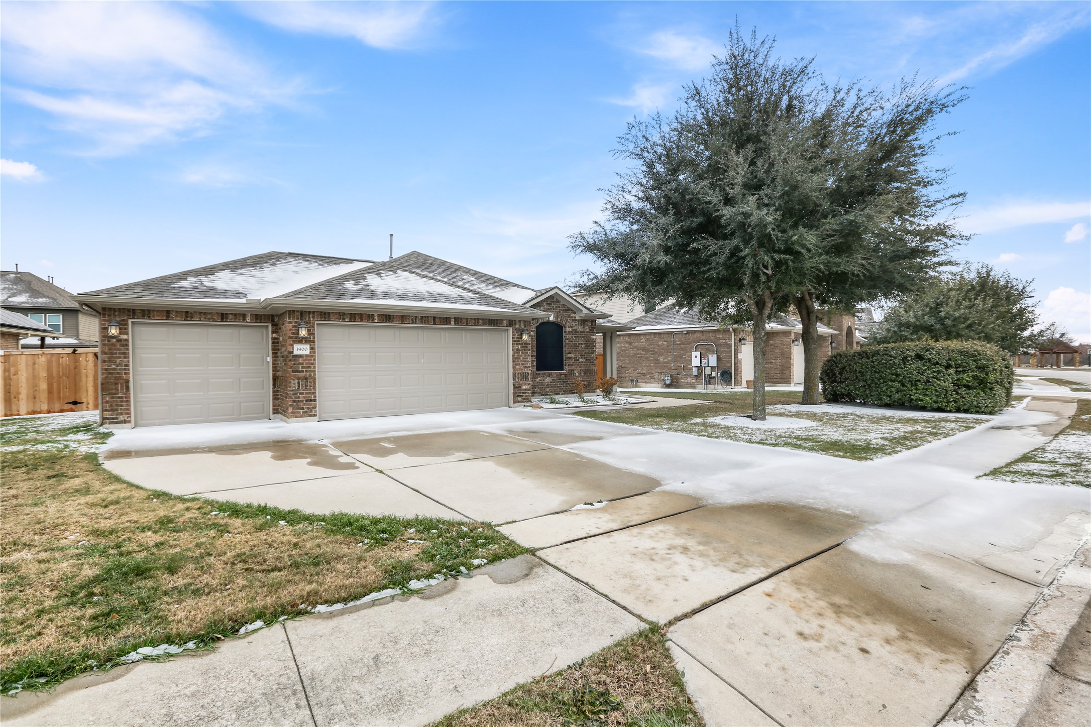 3900 Brean Down Road Pflugerville, TX 78660 - Photo 3 of 35 a front view of a house with a yard and garage