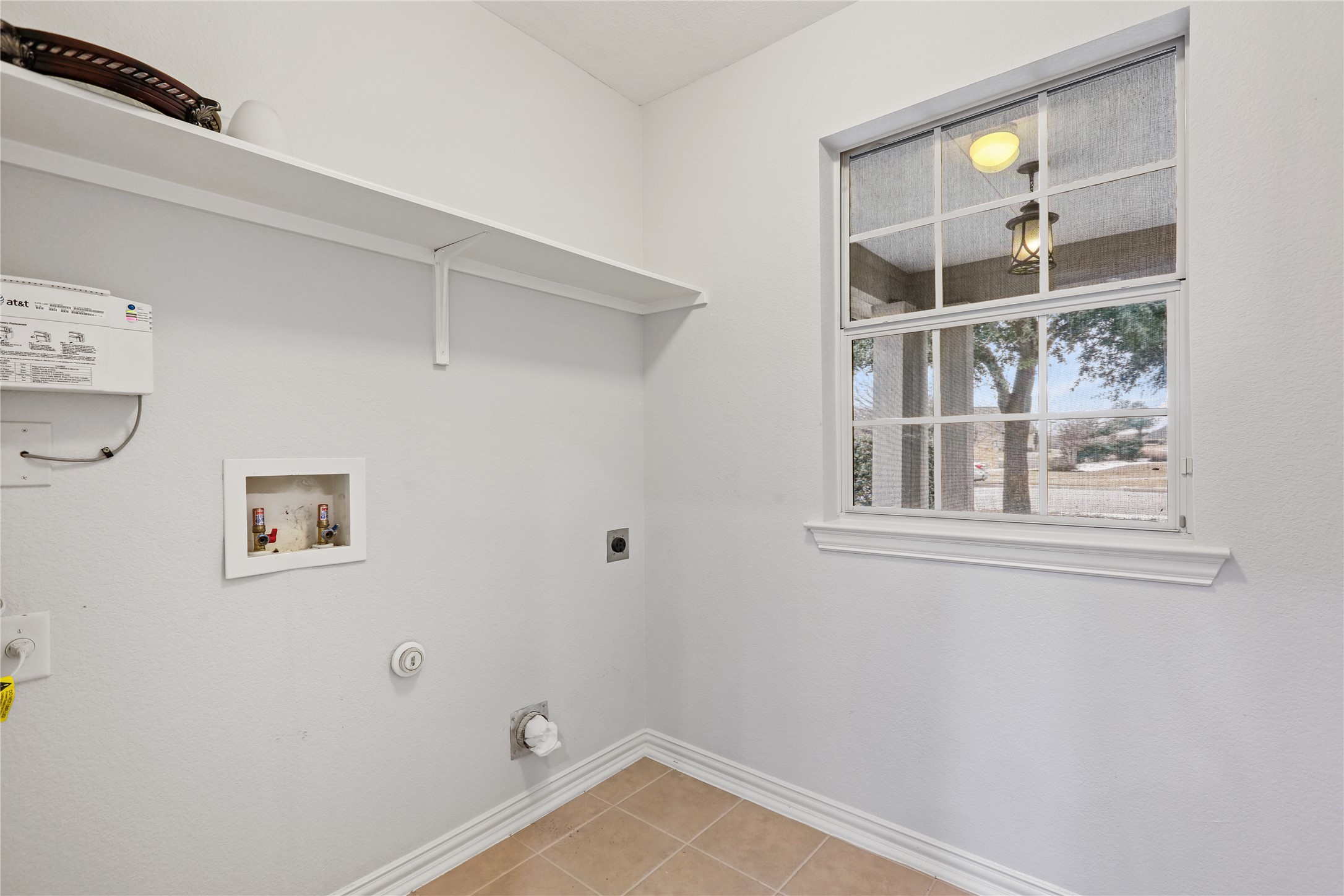 3900 Brean Down Road Pflugerville, TX 78660 - Photo 9 of 35 a view of a room with rack on the wall