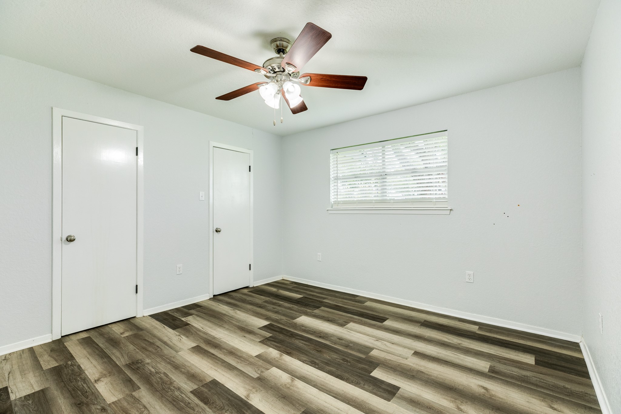 908 West Mulberry Street Angleton, TX 77515 - Photo 18 of 22 a view of a livingroom with a ceiling fan and window