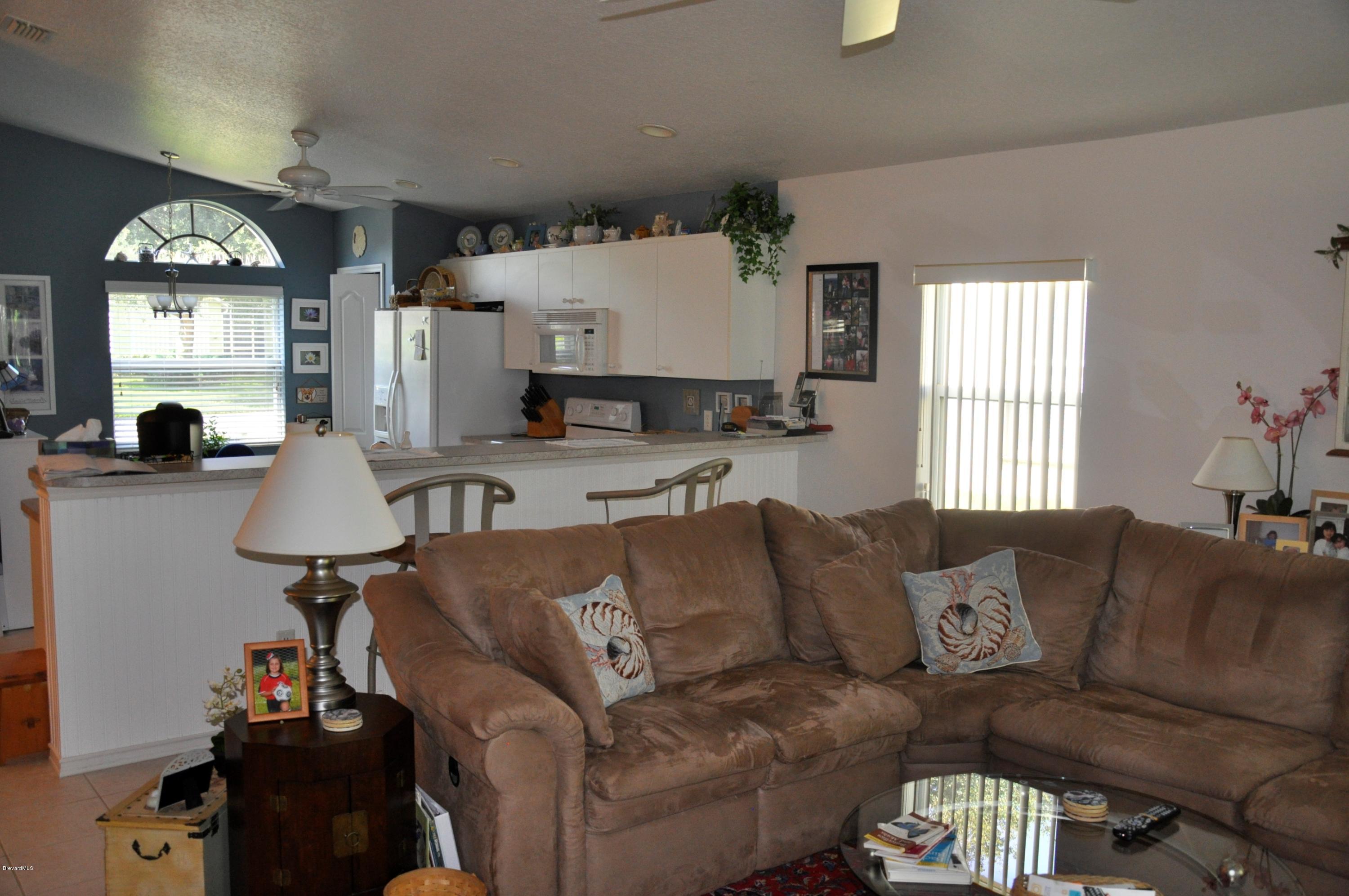 2135 Spring Creek Circle Palm Bay, FL 32905 - Photo 3 of 15 Living Room/Kitchen
