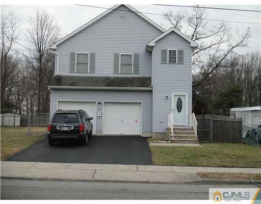 4 Ashley Road Edison, NJ 08817 - Photo 1 of 10 a view of a car parked front of a house