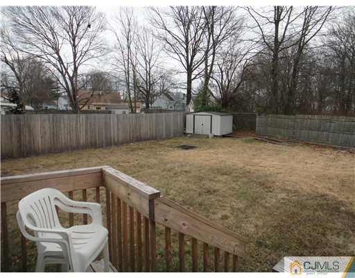 4 Ashley Road Edison, NJ 08817 - Photo 8 of 10 a view of backyard with wooden fence