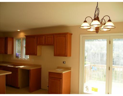136 Benz Street Springfield, MA 01118 - Photo 3 of 9 a kitchen with a sink and cabinets