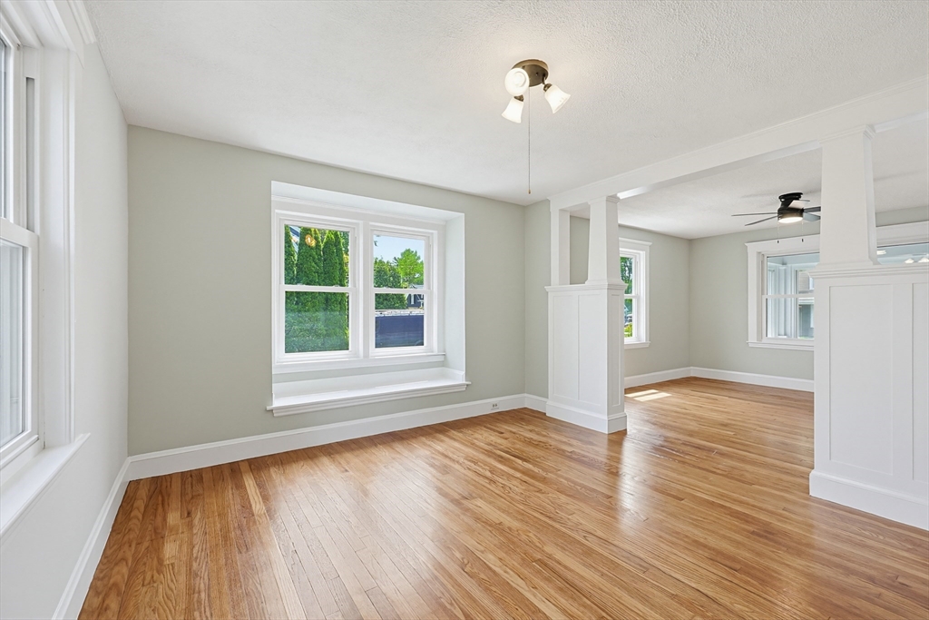 10 Water Street Natick, MA 01760 - Photo 5 of 35 a view of an empty room with wooden floor and a window