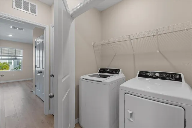 a utility room with dryer and washer
