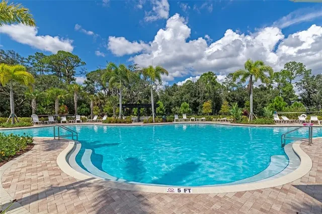 a view of a swimming pool in a backyard