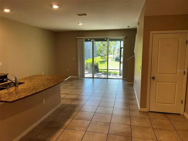 a view of a kitchen with a sink and a window
