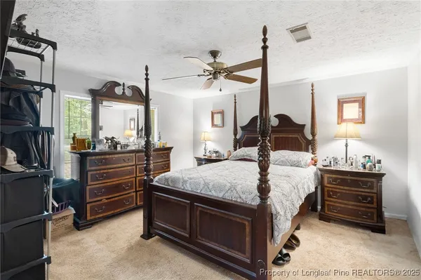 a bed room with a bed and a dresser