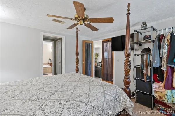 a bedroom with a bed and a walk in closet
