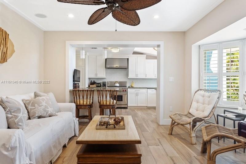 710 Woodcrest Road Key Biscayne, FL 33149 - Photo 12 of 34 a living room with furniture and a wooden floor