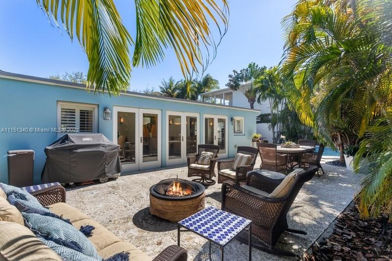 710 Woodcrest Road Key Biscayne, FL 33149 - Photo 24 of 34 a outdoor living space with furniture and a fireplace