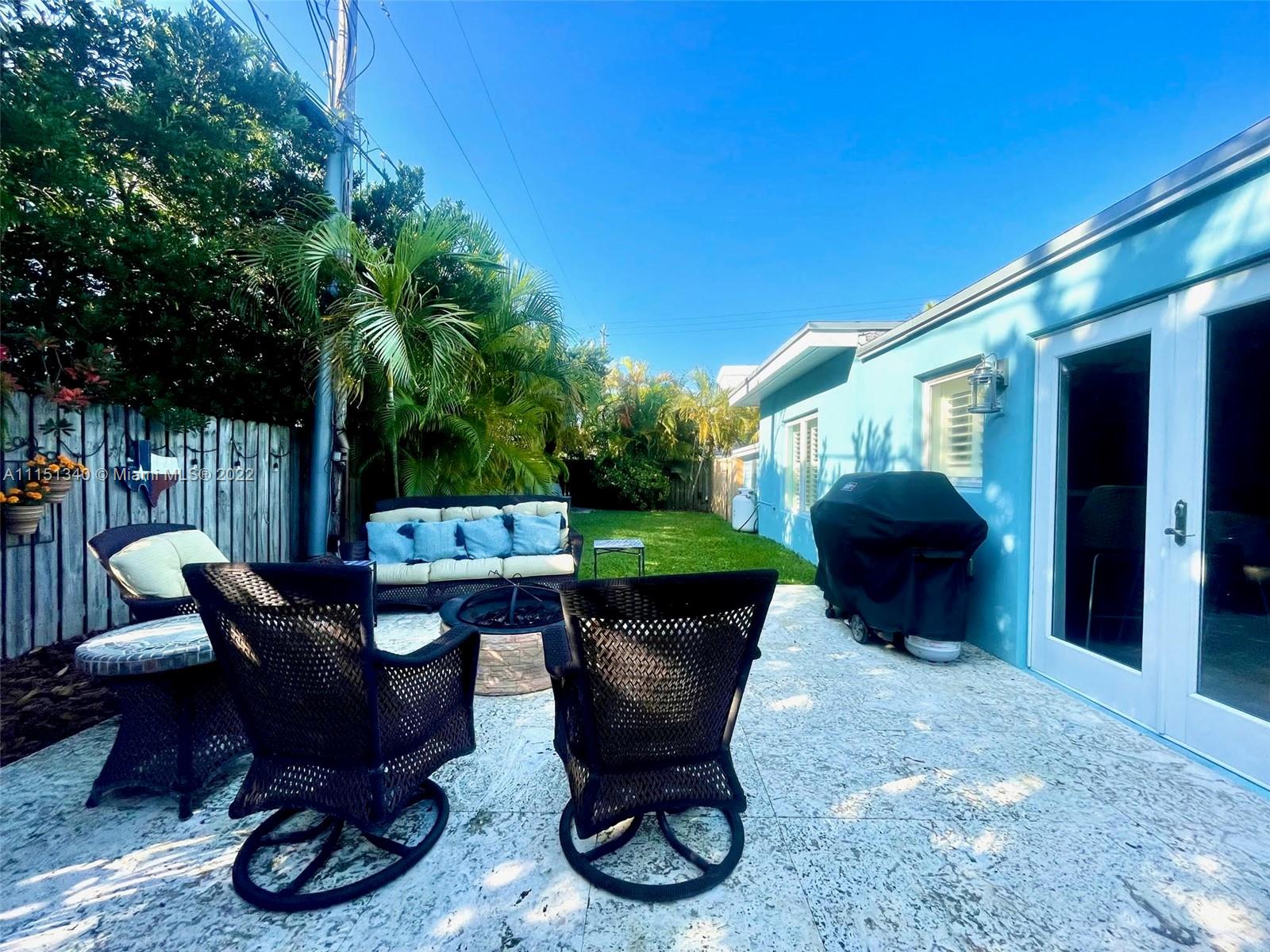 710 Woodcrest Road Key Biscayne, FL 33149 - Photo 27 of 34 a view of a chairs and tables in the patio