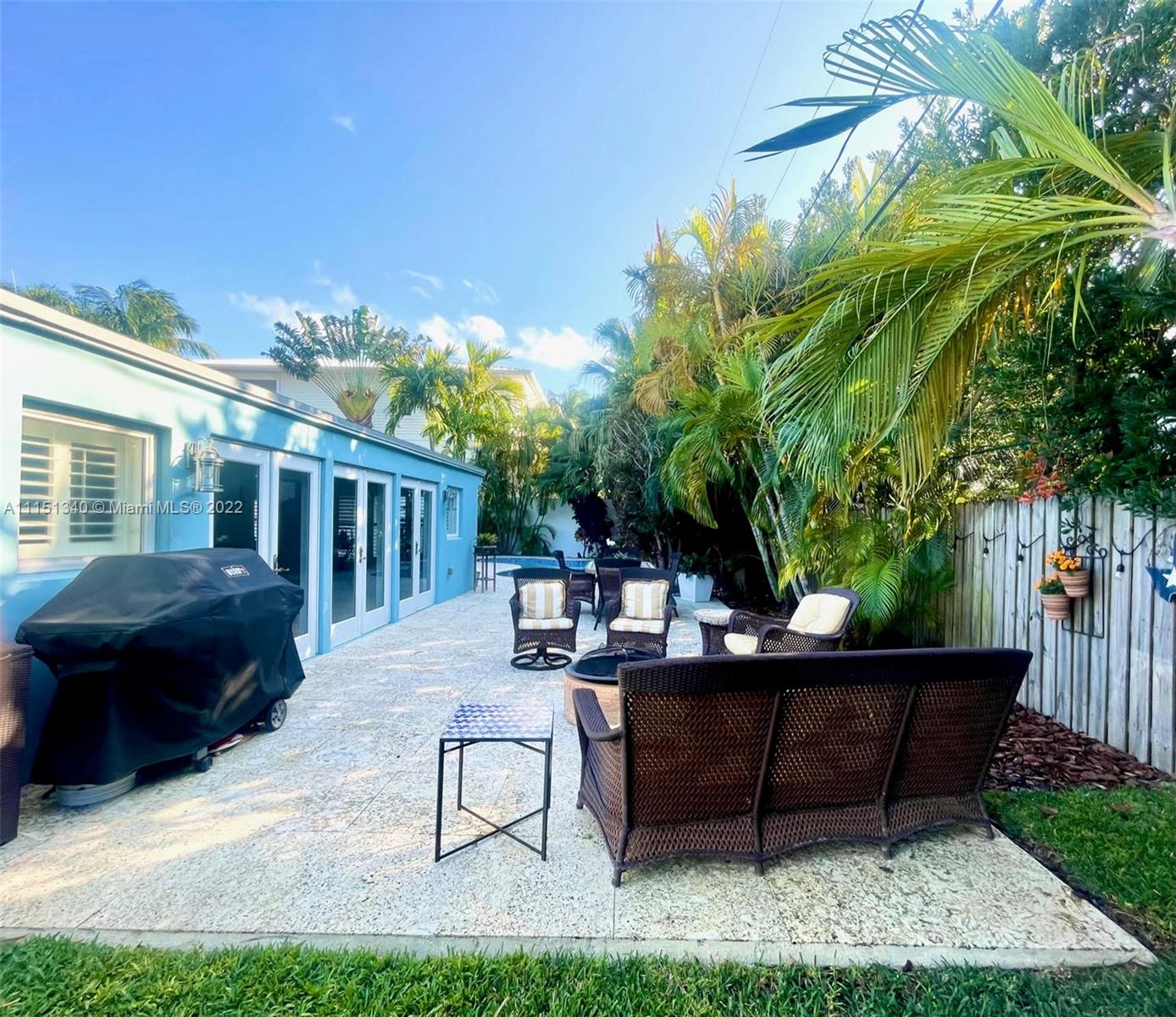 710 Woodcrest Road Key Biscayne, FL 33149 - Photo 28 of 34 a view of a house with backyard and sitting area