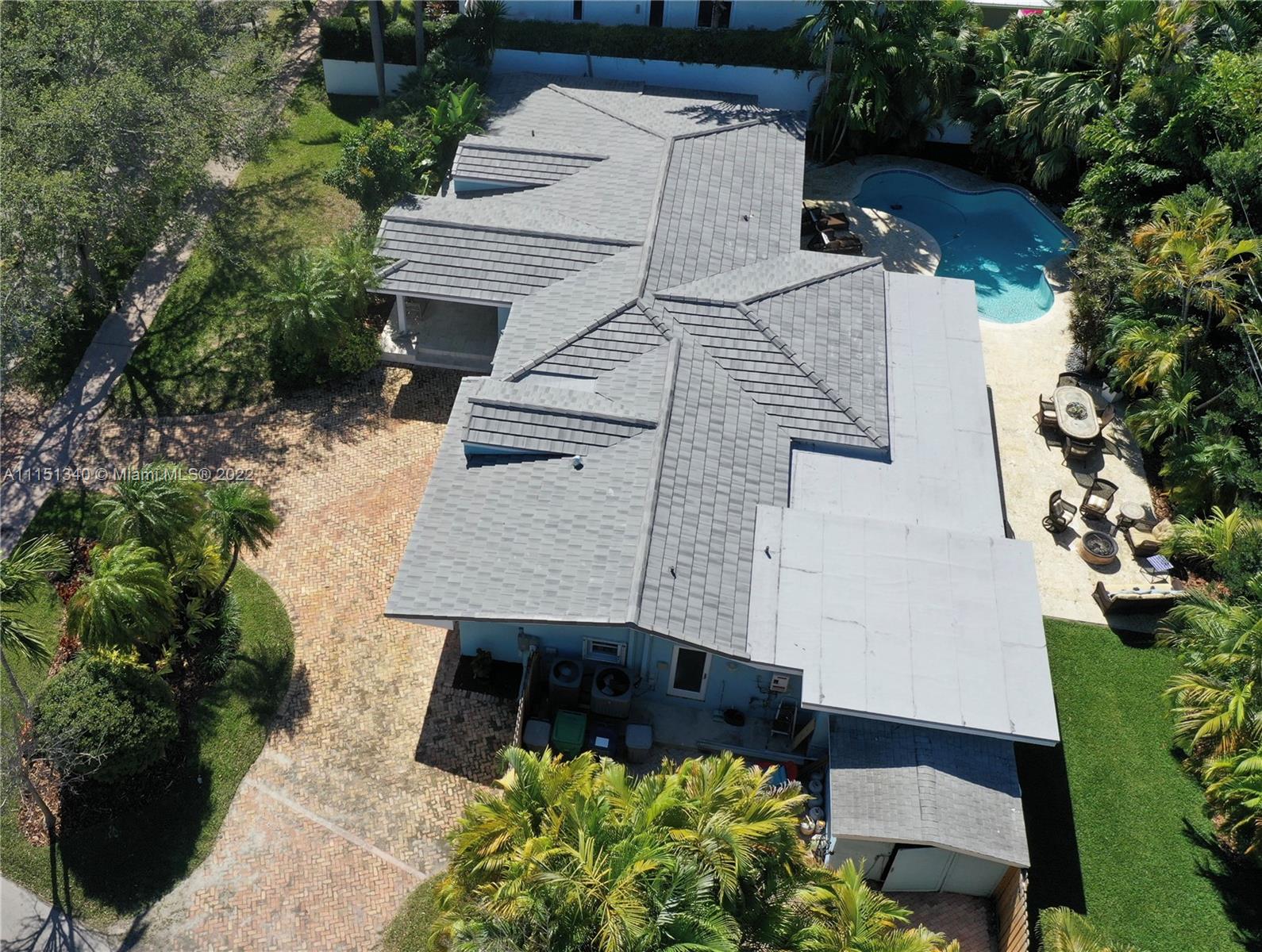710 Woodcrest Road Key Biscayne, FL 33149 - Photo 29 of 34 an aerial view of a house with a yard and garden