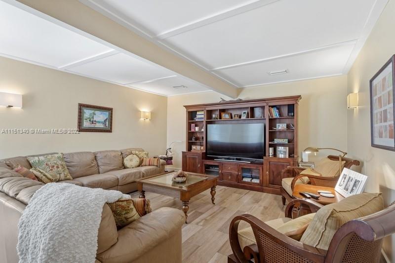 710 Woodcrest Road Key Biscayne, FL 33149 - Photo 6 of 34 a living room with furniture and a flat screen tv
