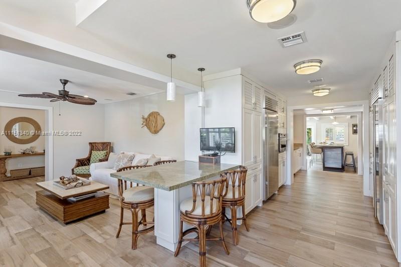 710 Woodcrest Road Key Biscayne, FL 33149 - Photo 9 of 34 a very nice looking dining room with a table and chairs