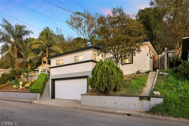 front view of a house with a street