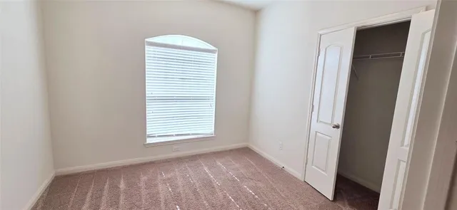 a view of a room that has a window in it