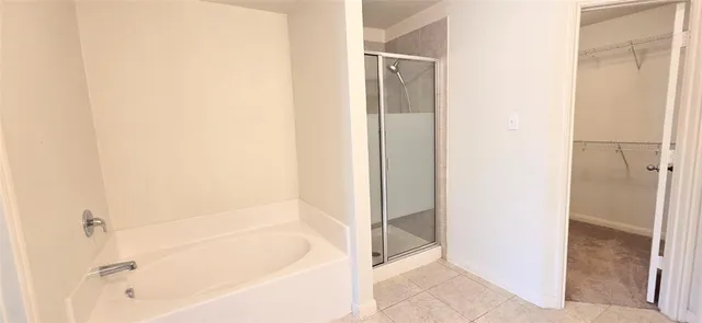 a bathroom with a glass shower door